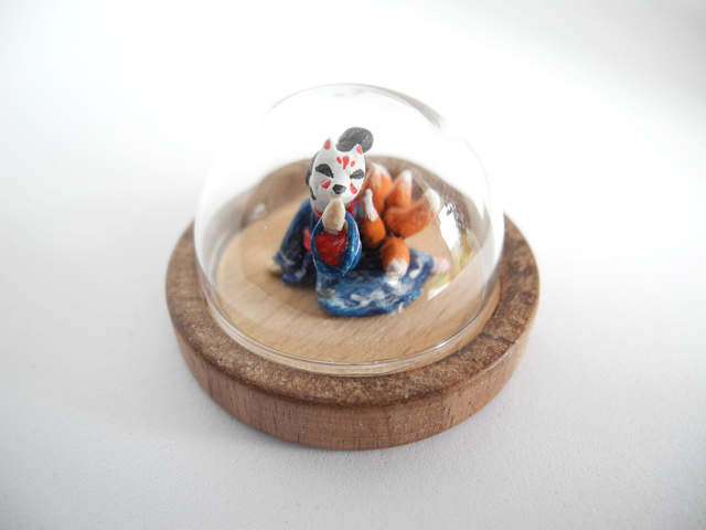 Kitsune disguised as Geisha in a Kimono adorned with waves - miniature pendant for Japan enthusiasts
