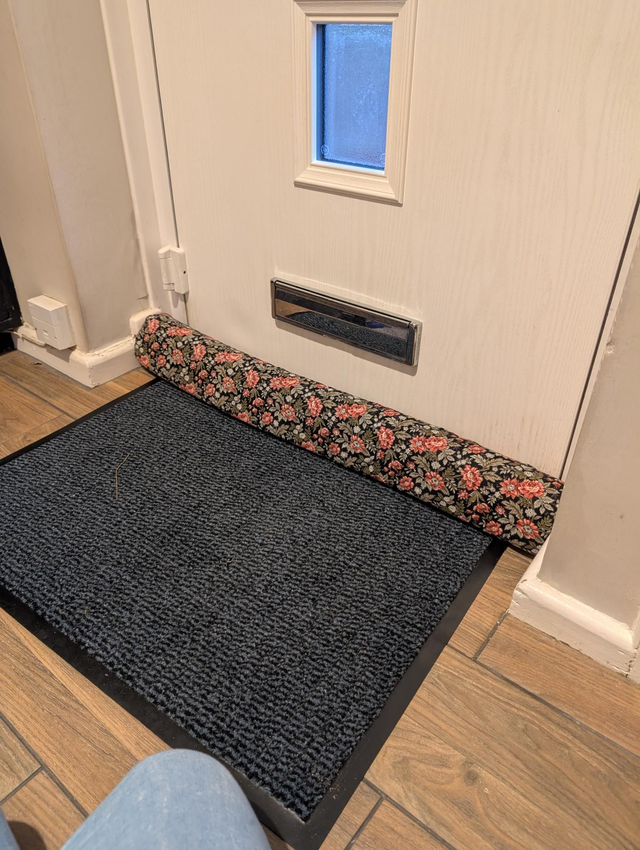 Dark floral draft excluder