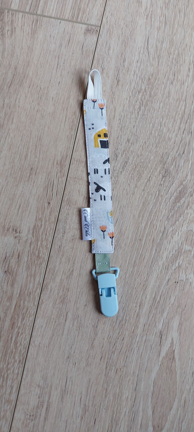 Attache sucette ferme