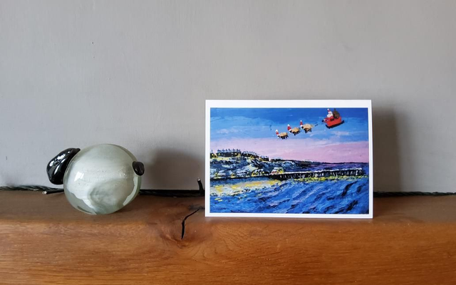 Father Christmas and his flying sheep over Saltburn by the sea. A6 card.