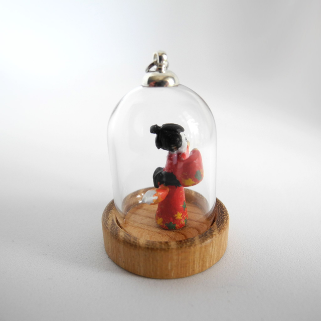 Kitsune disguised as Geisha in a Kimono adorned with autumn leaves - miniature pendant for Japan enthusiasts
