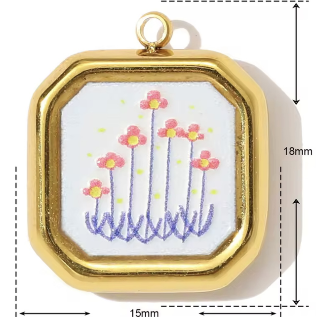 Charm sfaccettato fiorellini arancio 