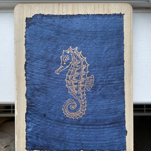 Gold Seahorse on Indigo washed cotton rag paper