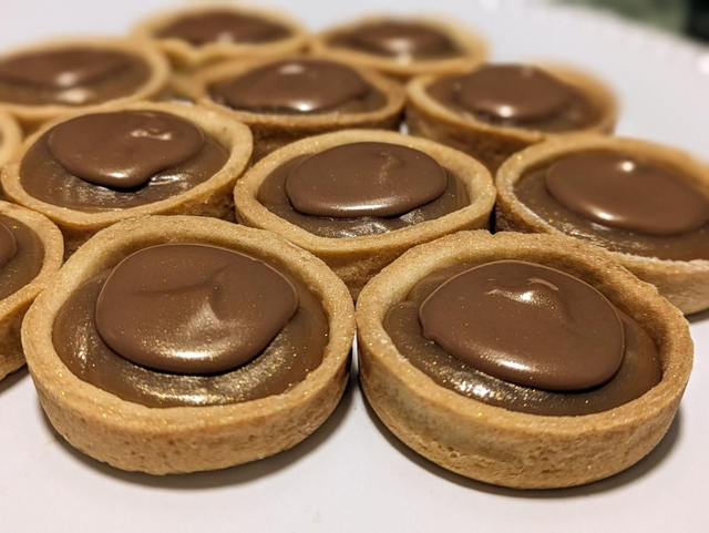 Mini millionaires, batch of 24, sweet short crust pastry cases filled with caramel and topped with milk chocolate 