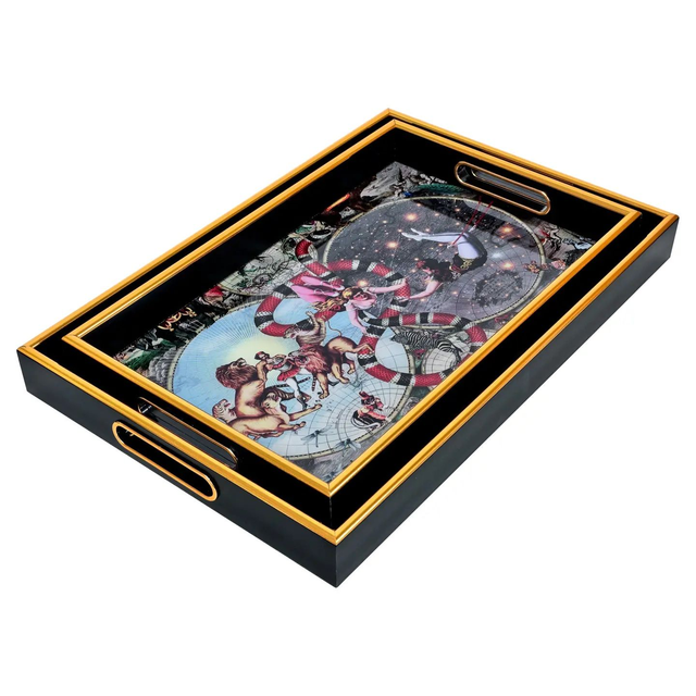 A set of 2 rectangular black and gold serving trays with a Myrtle and Mary Le Cirque Du Monde design,