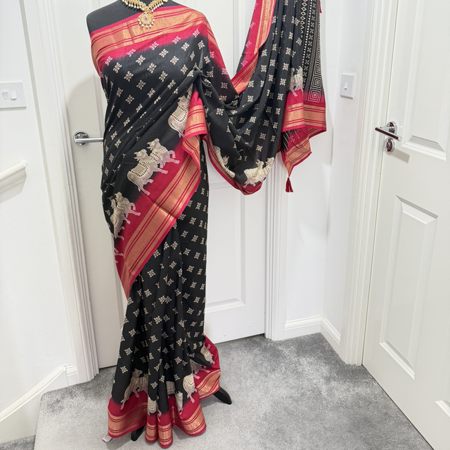 Dola silk black saree with pink border