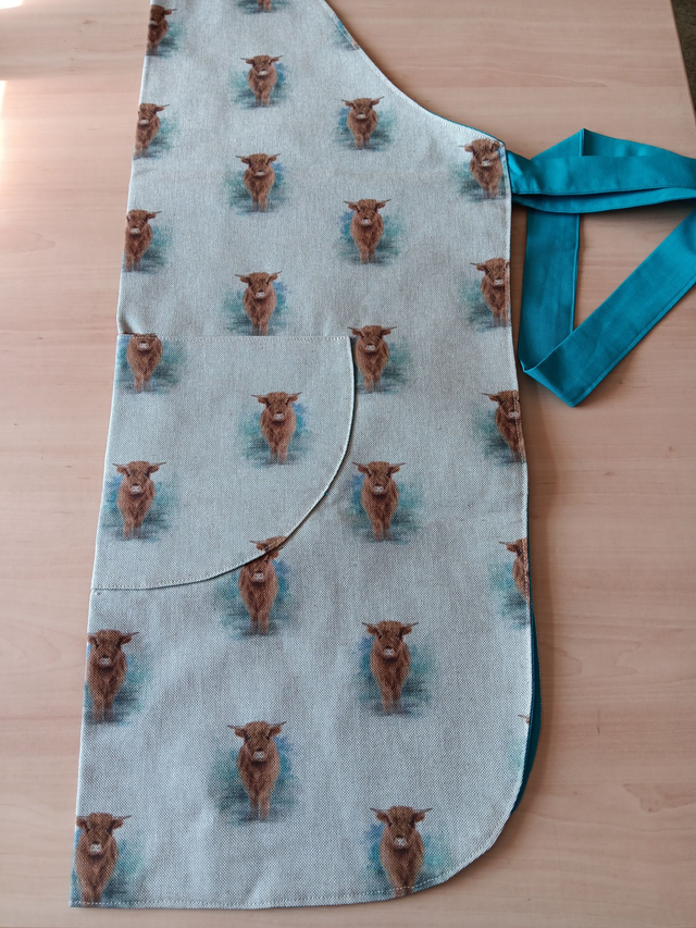 Adult Kitchen Apron Highland Cows(Coos) Patterned Cotton Fabric with Front pocket and turquoise lining, waist ties and adjustible neck ties