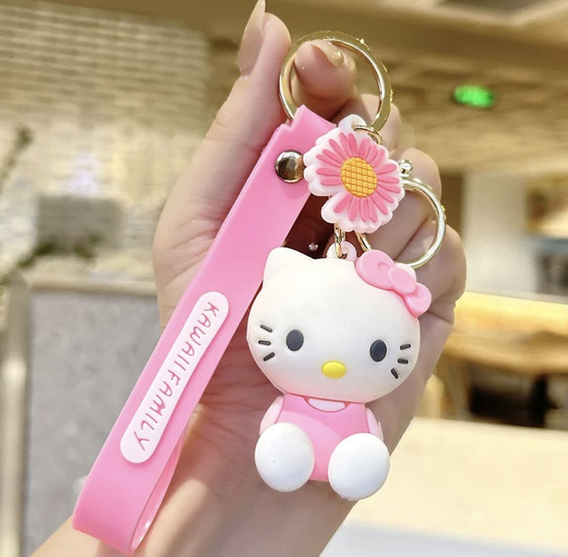 0153 - Hello Kitty - zittend - Roze