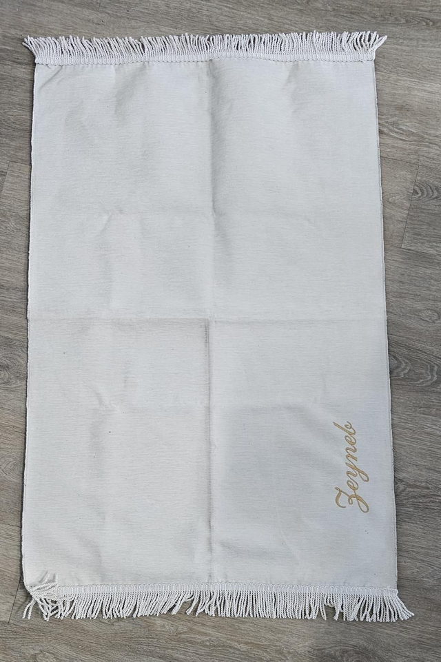 Tapis de prière brodé