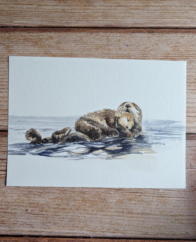 Maman et bébé loutres