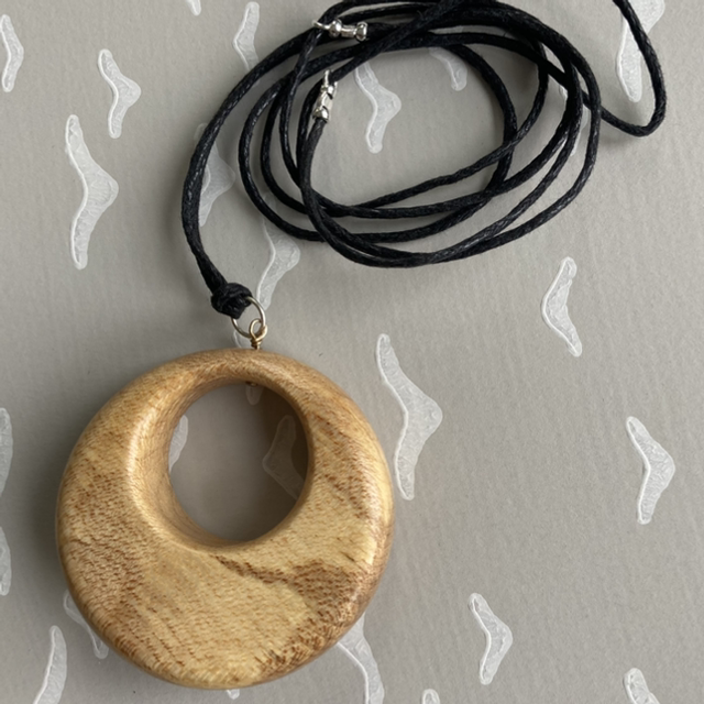 Sycamore - Circular pendant with an off centre hole - I was an offcut [005-0017]
