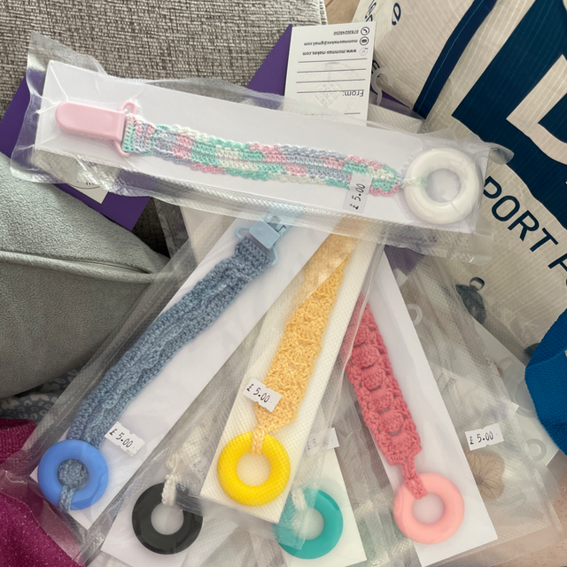 Dummy strap &amp; soother teething ring on a universal dummy strap 