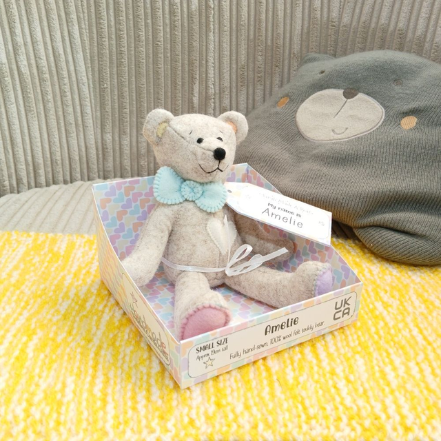 Amelie. Small size, handmade teddy bear. UKCA. Tray base packaging. Standard Wool Felt. Beige. Pastel rainbow. Pink. Yellow. Purple. Orange. Blue. 