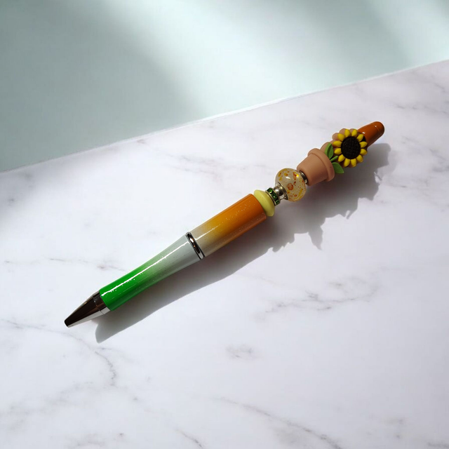 Stylo perles brun orange vert