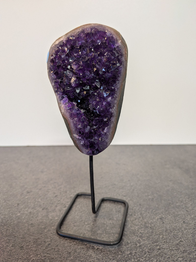 Amethyst cluster on a stand