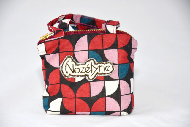 Porte monnaie avec anse géométrique 