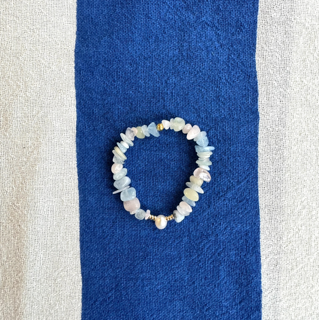 A rose in between gold thorns 