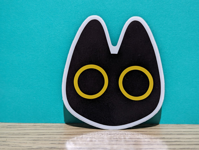 Big Yellow Eyed Black Cat Sticker 8x8cm