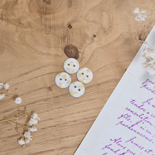 Petits boutons motif fleuri nacré et doré