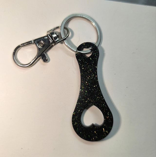 Jeton de caddie noir à paillettes vertes 