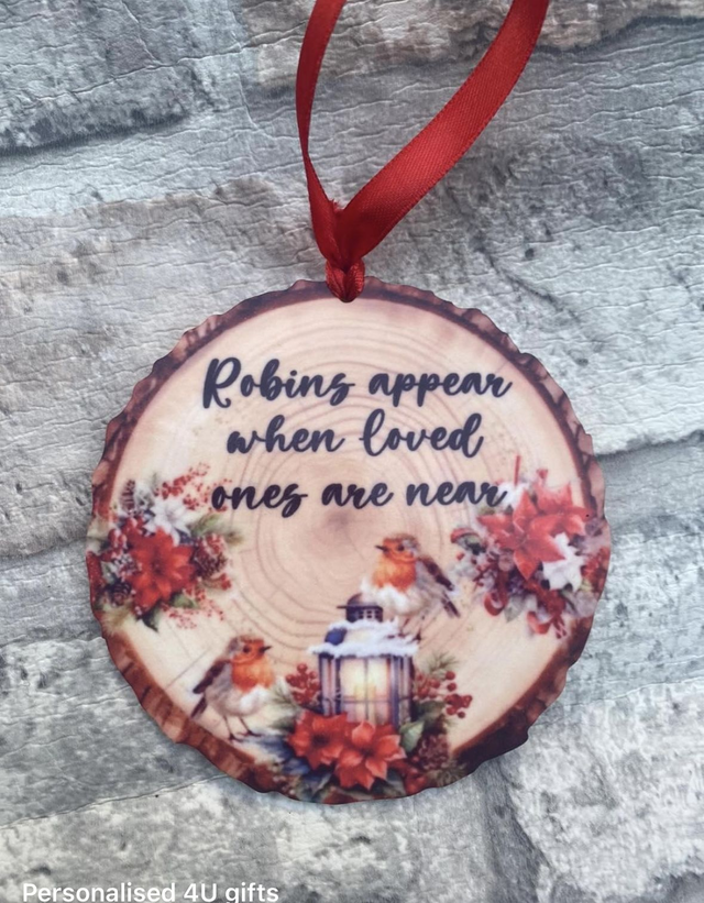 Robins appear hanging bauble