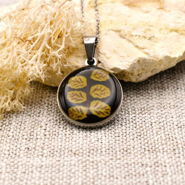 Real fern in round pendant