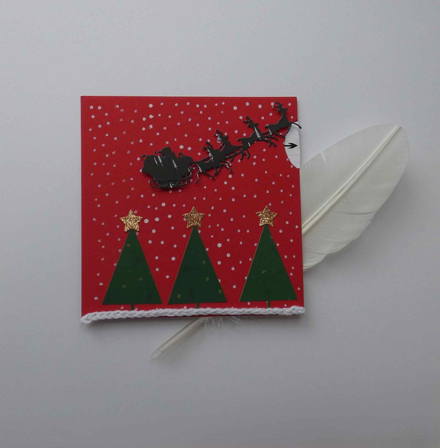 Joli traîneau au-dessus de la forêt (carte à tirette)