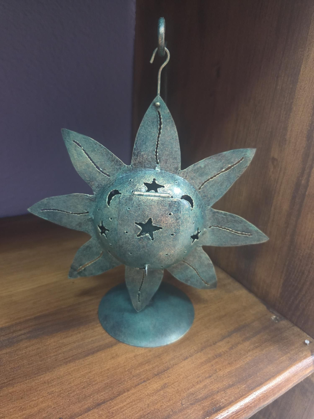 Candelabro de metal sol