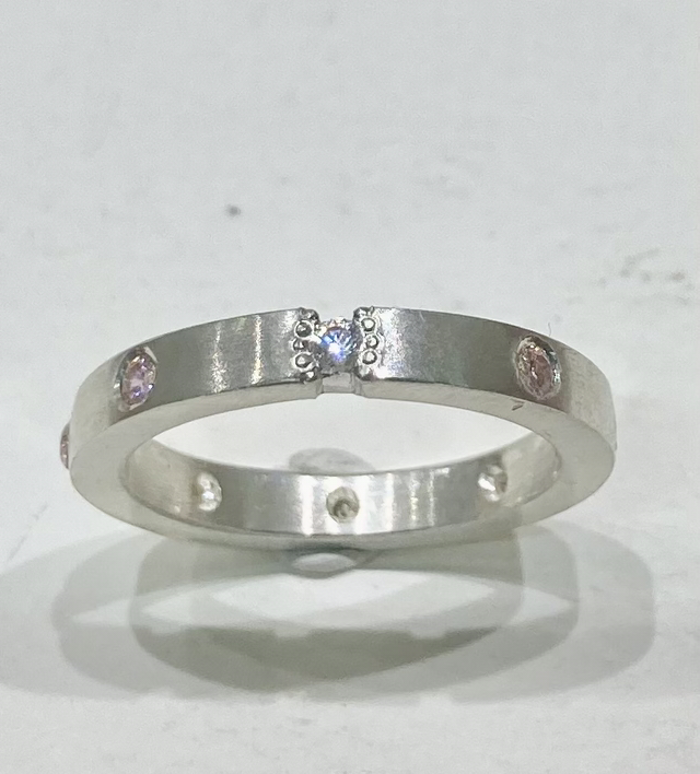 Flat band silver ring with 8 cubic zirconia 
