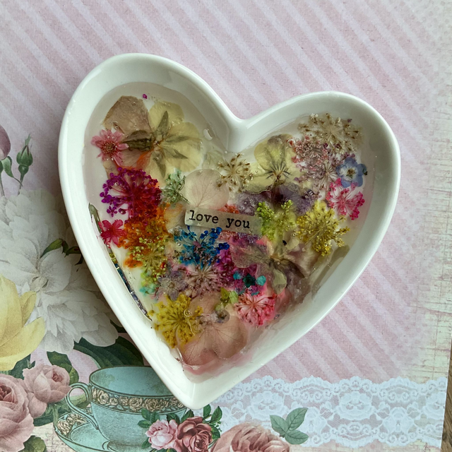 White porcelain ring trinket with pressed flowers in resin.