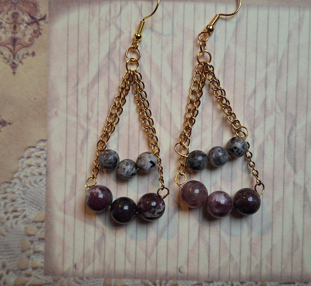Leto's cradles in gold with AA grade yooperlite and red tourmaline, two earrings