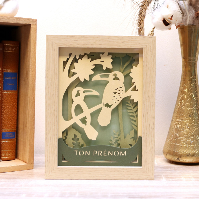 Veilleuse des toucans beige dans la jungle kaki