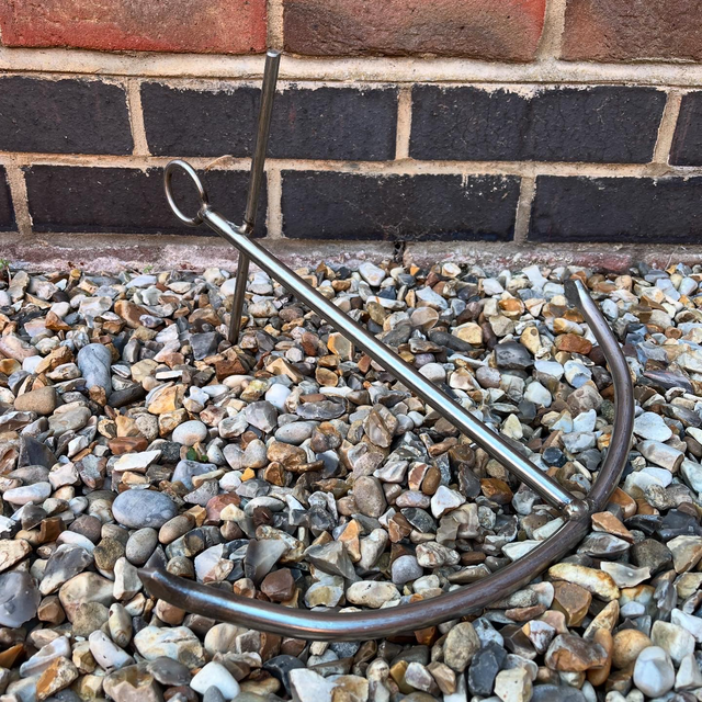 A Stainless Steel Decorative Sculpture Of An Anchor 