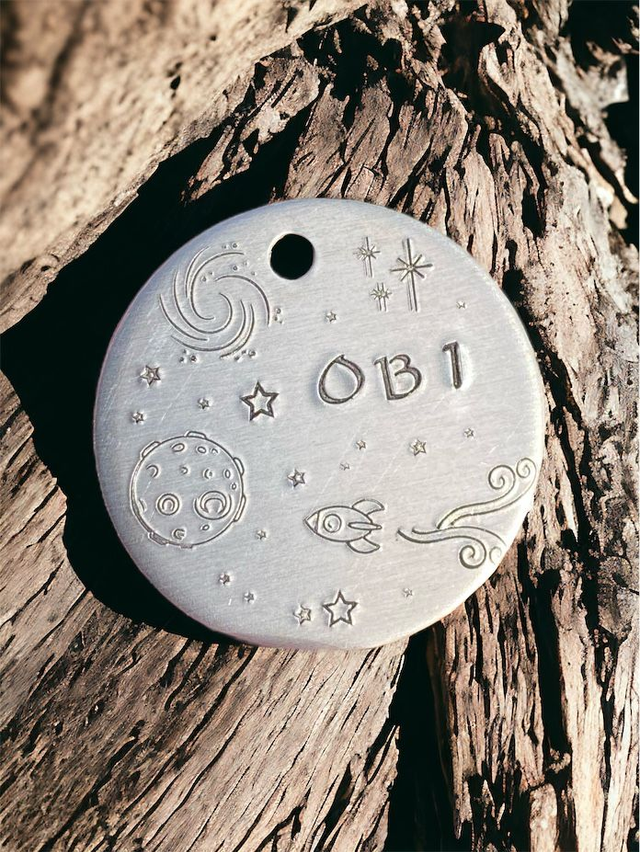 Space themed handstamped personalised pet ID tag 