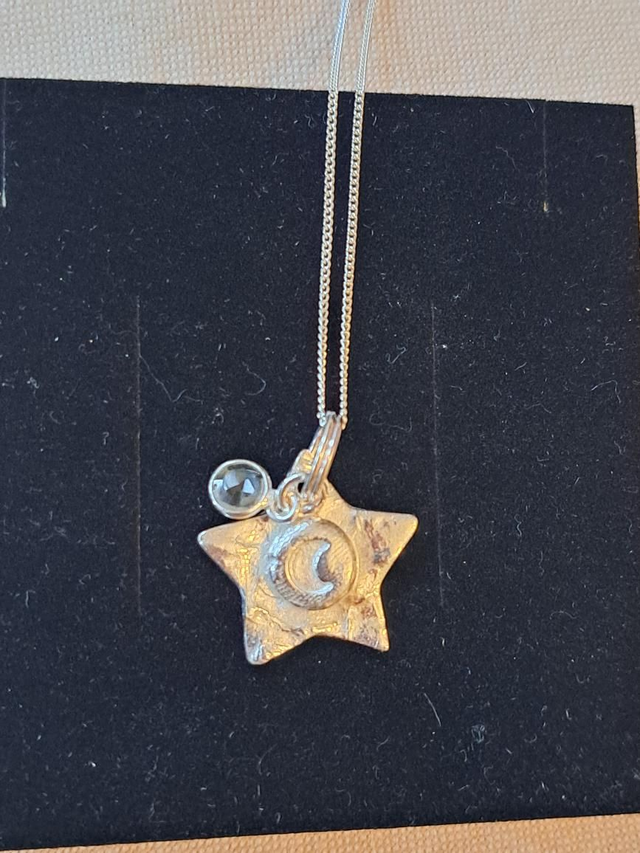 Silver Star and moon pendant with quartz charm