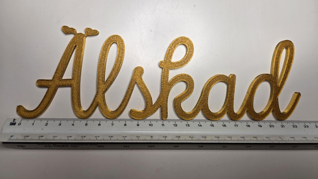 Söt väggdekor / kylskåpsmagnet "Älskad" i guld

