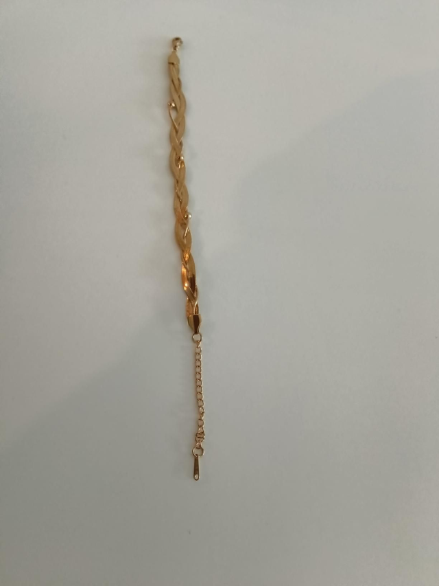 Bolletjes en gevlochten goud kleurig