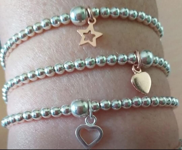 Sterling silver stacking bracelets (several charms)