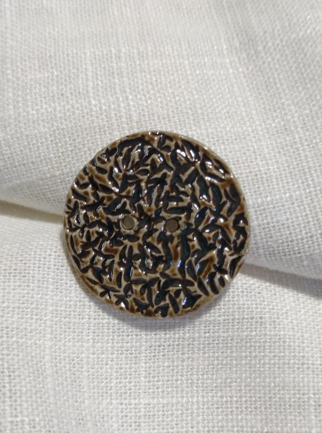 Bouton texturé grège/bleu foncé 