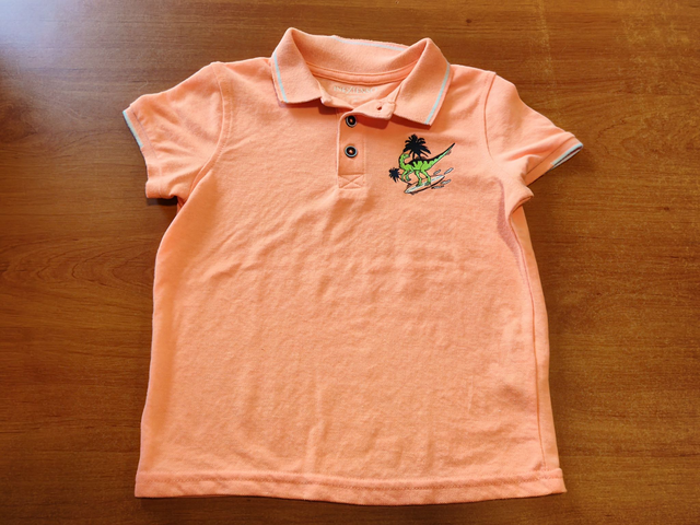 Polo orange en 6 ans
