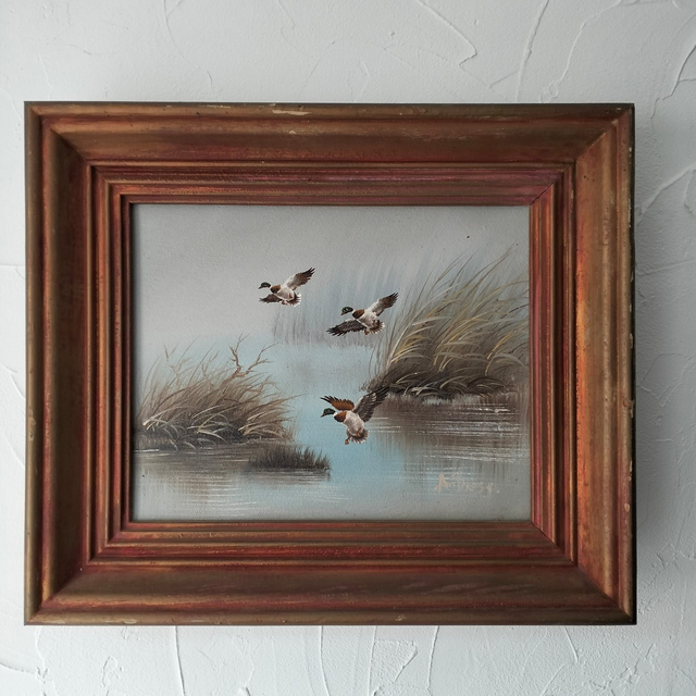 Huile sur toile signé – Trois canards sur un lac.