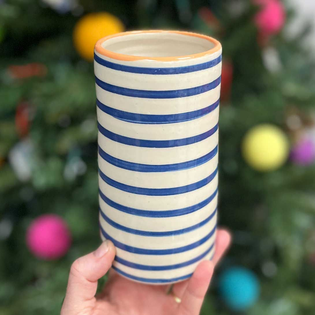 Blue striped vase with orange colour pop top
