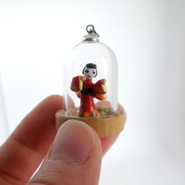 Kitsune disguised as Geisha in a Kimono adorned with autumn leaves - miniature pendant for Japan enthusiasts