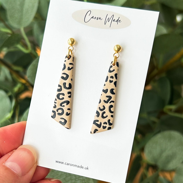 Long animal print earrings with ball studs