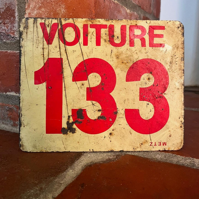 A French SNCF Railway Sign reading ‘Voiture 133’ which translates to ‘Car’ or ‘Carriage’ ’133’ for the City of Tourcoing in Northern France