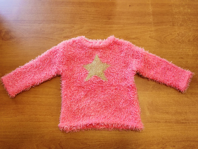 Pull rose étoile en 6 mois