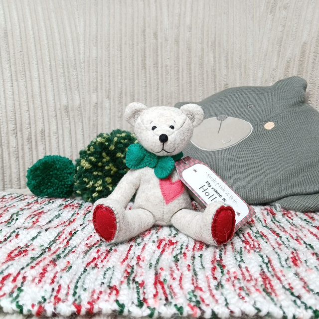Holly. Small size, handmade teddy bear. UKCA. Tray base packaging. Standard Wool Felt. Traditional. Beige. Emerald green. Christmas red. Sorbet pink.