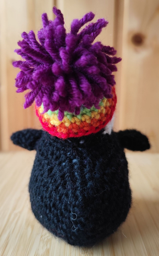 Fluffy the puffin with rainbow hat, small size (made from merino wool yarn)