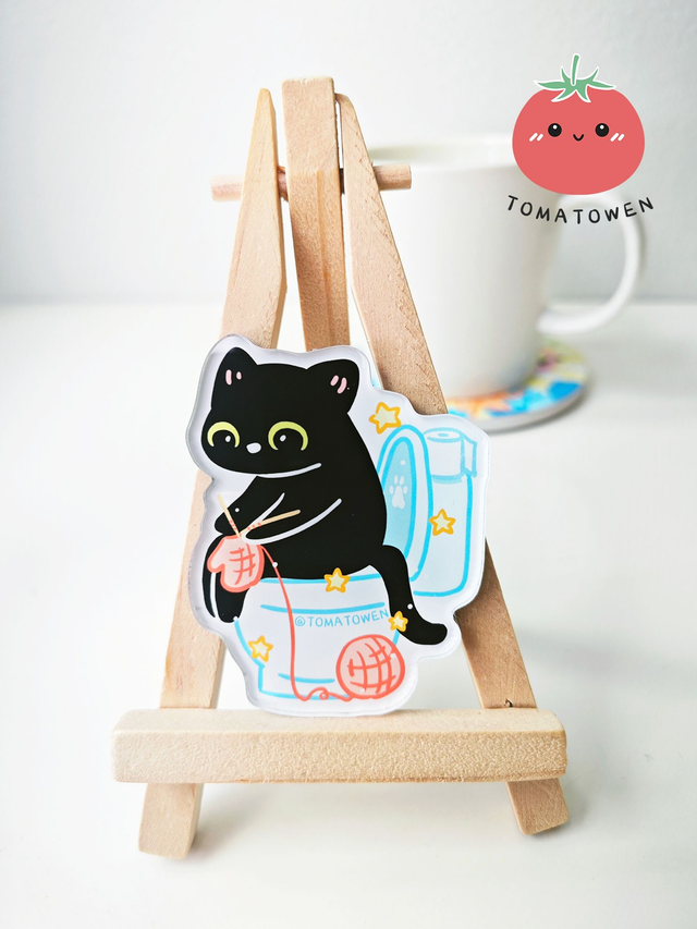 Fridge magnet: Black cat Kola knitting on toilet