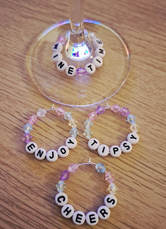 Wine glass charms with wine themed words